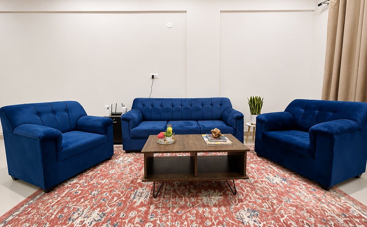 Furnished corporate housing living room with blue sofas